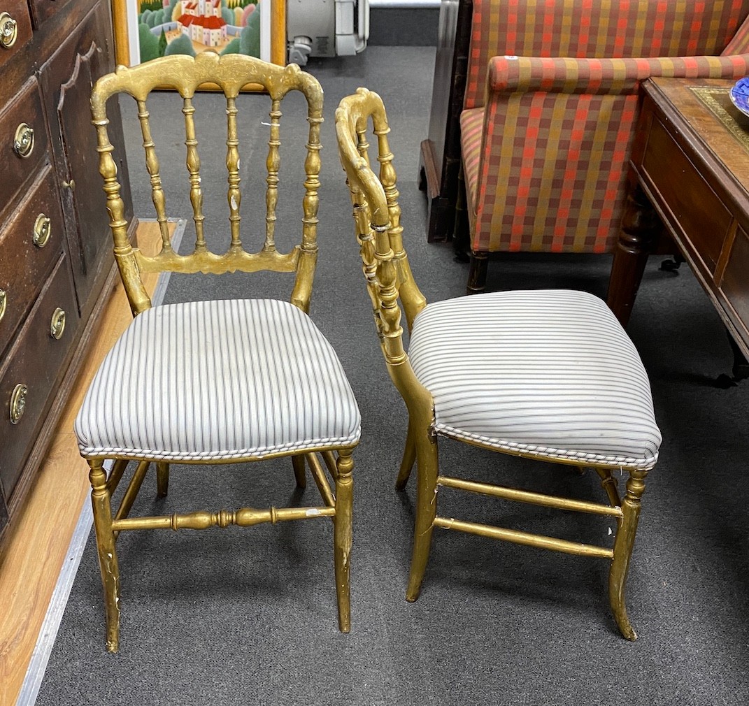 A set of four giltwood chairs